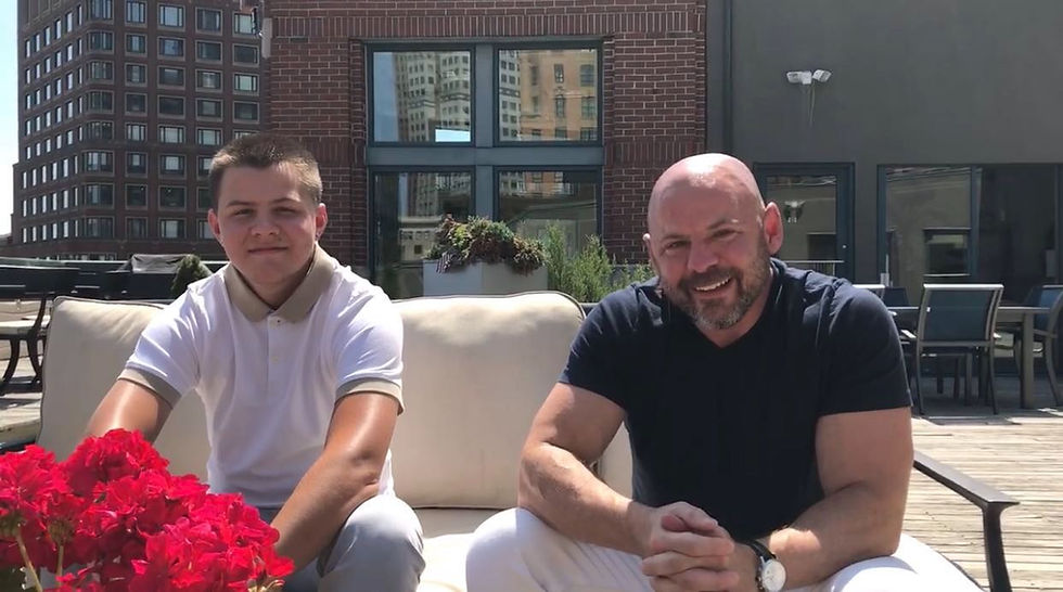 father and son posing outside