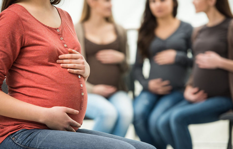 group of pregnant women sitting