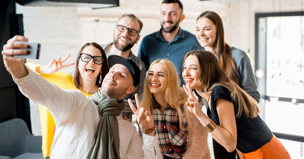 Group of friends posing for a selfie (models)