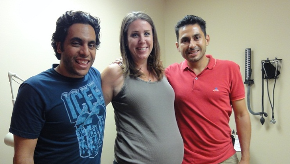 Surrogate posing with intended parents