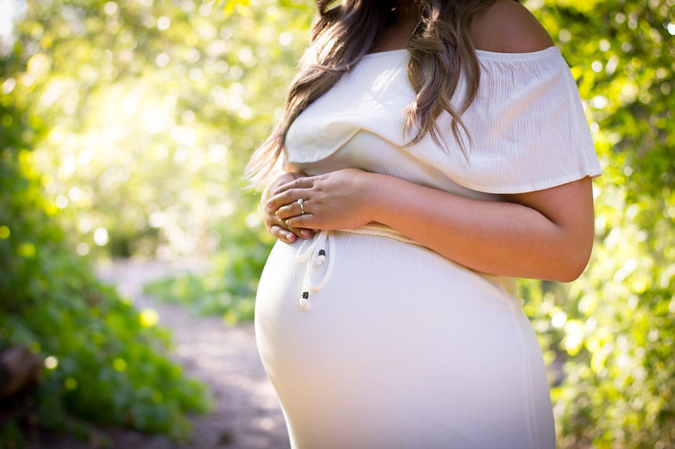 pregnant woman with hands on belly