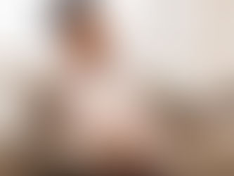 Pregnant woman taking a selfie, smiling at the camera (model). Credit: Getty Images / Prostock-Studio.