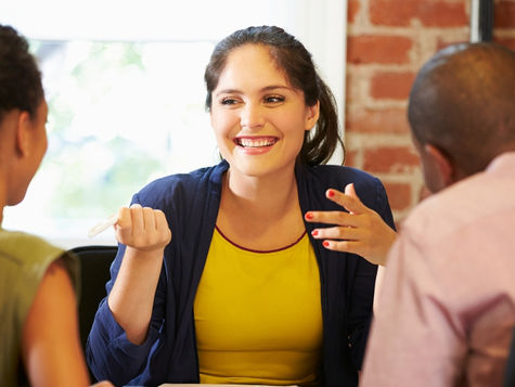Couple meeting with a consultant in a bright, modern office (models)