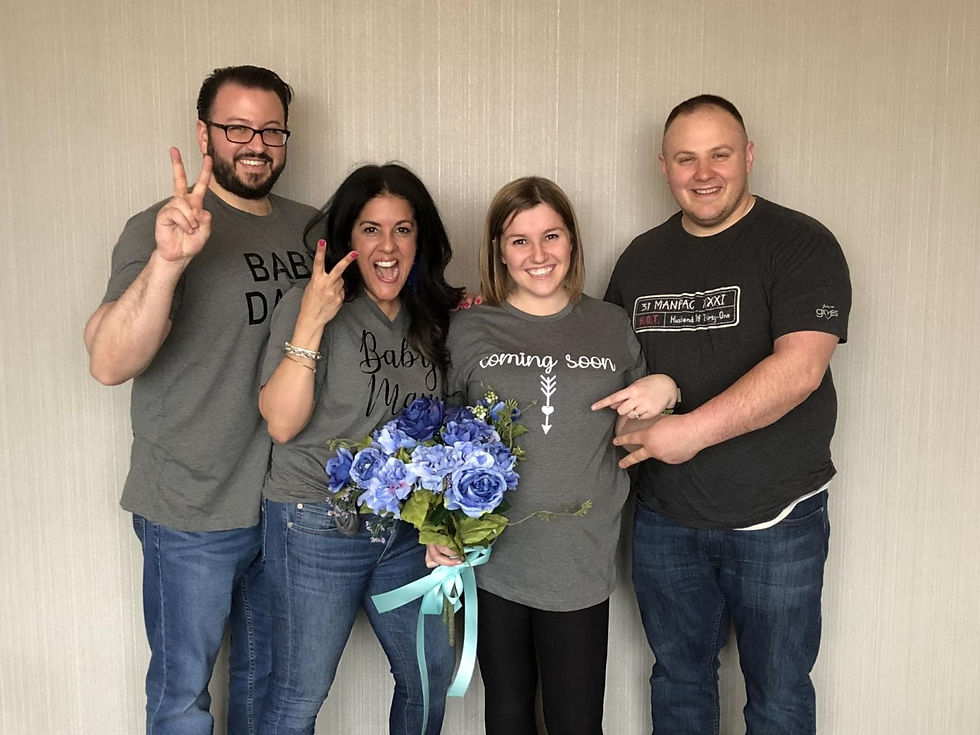 surrogate couple with expecting parents smiling