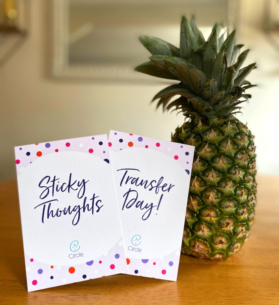 Pineapple with sticky notes that say "sticky thoughts" and "transfer day"
