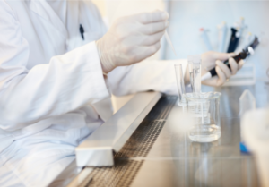 close up handling test tubes