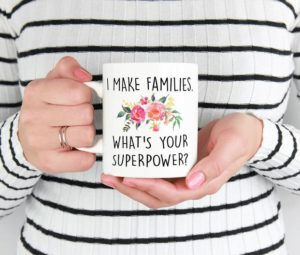 Close-up on mug that says "I make families. What's your superpower?"