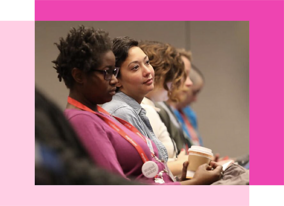 women sitting in audience at conference