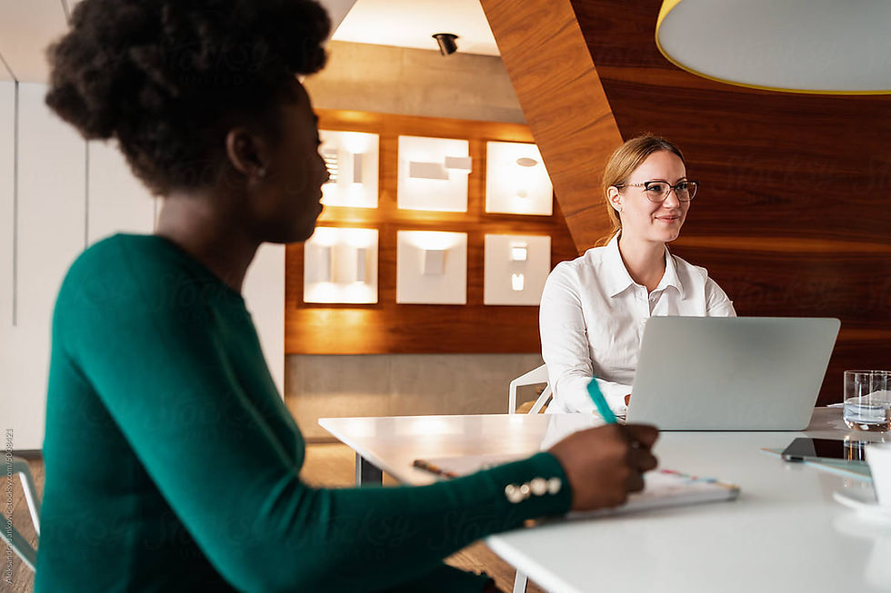 couple reading document with insurance consultant