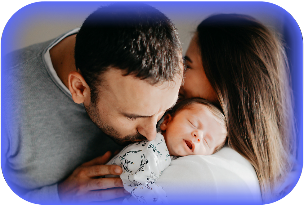 Parents lovingly kiss newborn baby