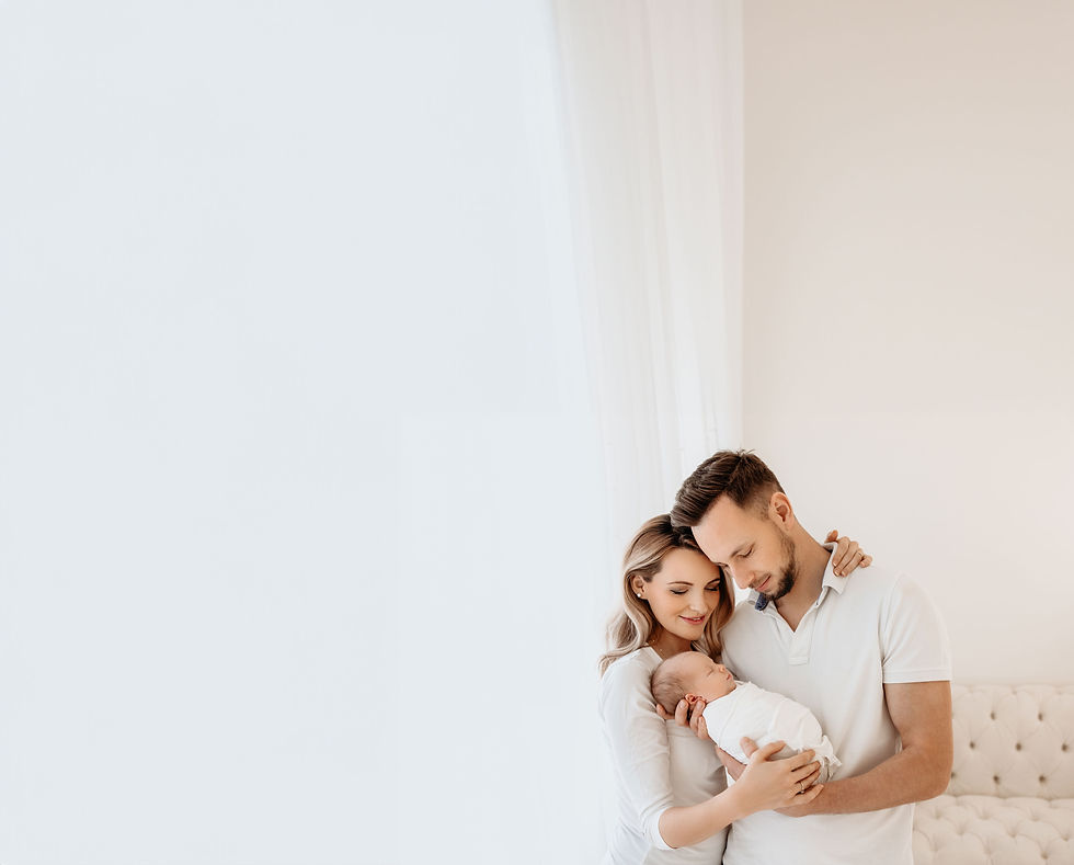 Happy parents holding their newborn baby