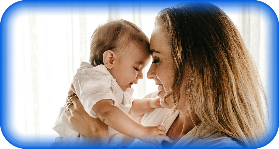 Happy mother tenderly holding her baby